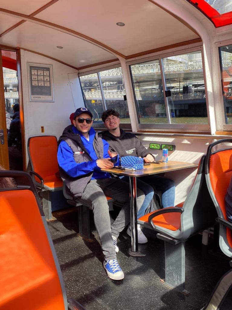 Students enjoying the sights of Amsterdam by canal cruise.