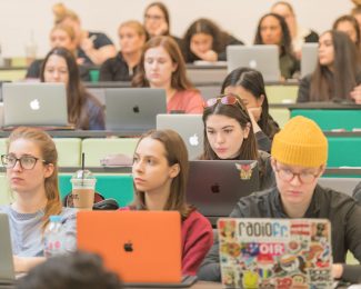 group of students sitting in a lecture theatre