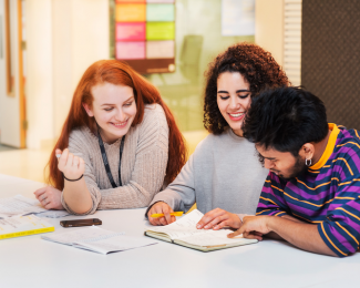 Three students revising together at university